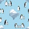 Seamless pattern. Emperor penguins on a blue background. Icebergs