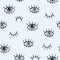 Seamless pattern with eyes on a blue background. Bohemian style background for design. Abstract print of open and close eyes. Hand