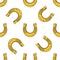 Seamless pattern with falling gold horseshoes