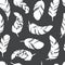 Seamless pattern with feather silhouettes