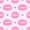 Seamless pattern with female pink lipstick kiss and polka dot.