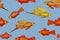 Seamless pattern with a flock of tropical fish.