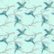 Seamless pattern of flying birds on branches of trees in watercolor style