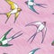 Seamless pattern with flying colorful swallows