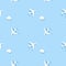 Seamless pattern of flying planes and clouds on blue background