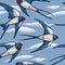 Seamless pattern with flying swallows