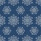 Seamless pattern with geometric snowflakes