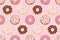 Seamless pattern with glazed donuts. Pink colors. Girly. For print and web.