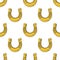 Seamless pattern with gold horseshoes