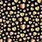 Seamless pattern of gold metallic hearts with a gradient on a black background