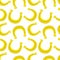 Seamless pattern with golden horseshoes.