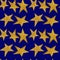 Seamless pattern with golden metallic stars on a night blue sky background