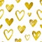 Seamless pattern with golden shining hearts