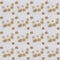 Seamless pattern of golden snowflakes on a white background