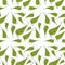 Seamless pattern green swirling spiral leaves of different shapes on a white background