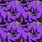 Seamless pattern for halloween bat, witch hat, a cat skull on pu