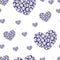 Seamless pattern with hearts with small evil eyes inside