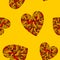 Seamless pattern with hearts on yellow background.