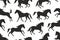 Seamless pattern with horses silhouettes