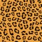 Seamless pattern. Imitation of skin of leopard. Black and brown spots on brown background.