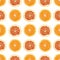 Seamless pattern of isolated slices of grapefruit and orange.