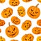 Seamless pattern with Jack-O-Lantern (Halloween pumpkins). Vector illustration.