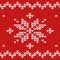 Seamless pattern. Knitted fabric. Ornament snowflake. Wool. Winter decor. Red. Vector.