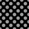 Seamless pattern of large grey polka dots on a black background