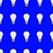 Seamless pattern of light bulbs on a blue color