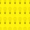 Seamless pattern of light bulbs yellow color
