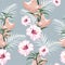 Seamless pattern, light vintage colors palm leaves and hibiscus. tropical lilies flowers on vintage blue background.