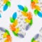 Seamless pattern made of white chicken eggs with colored ostrich feathers on a white background