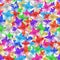 Seamless pattern many colorful stars, bright shiny stars repeating ornament, vibrant glittering starry background, trendy print