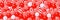 Seamless pattern with many white and red candies