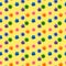 Seamless pattern of multi-colored viruses isolated on a yellow background.