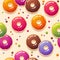 Seamless pattern. Multicolor donuts and small round candy on light background.