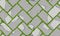 Seamless pattern of old pavement with moss and herringbone textured cracked old bricks