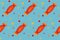 Seamless pattern with orange candies with dots on blue board. Halloween illustration. Trendy hand drawn design