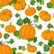 Seamless pattern with orange pumpkins and green le