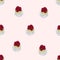 Seamless pattern of pavlova cakes with pistachio cream and raspberries on a pink background.