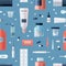 Seamless pattern with pharmacy medications in bottles, ampoules, jars, tubes, blisters and medical tools on blue