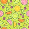 Seamless pattern. Pieces of oranges, limes, lemons and cherries on a green background.