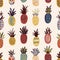Seamless pattern with pineapples of various color and texture on light background. Backdrop with exotic tropical ripe