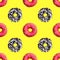 Seamless pattern pink and chocolate donuts on yellow background isolated top view, colorful donut repeating ornament, wallpaper