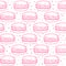 Seamless pattern with pink macarons