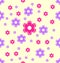 Seamless pattern pink and purple flower shapes.