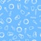 Seamless pattern. Plates, glasses and cutlery on a light blue background.