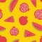 Seamless pattern with pomegranates and watermelon slices on yellow background. Backdrop with fresh ripe organic tropical