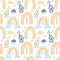 Seamless pattern, print of doodles, drawn cute multicolored rainbows, clouds and houses, decor for kids bedroom.