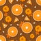 Seamless pattern with pumpkin pies and pumpkins on a wooden background